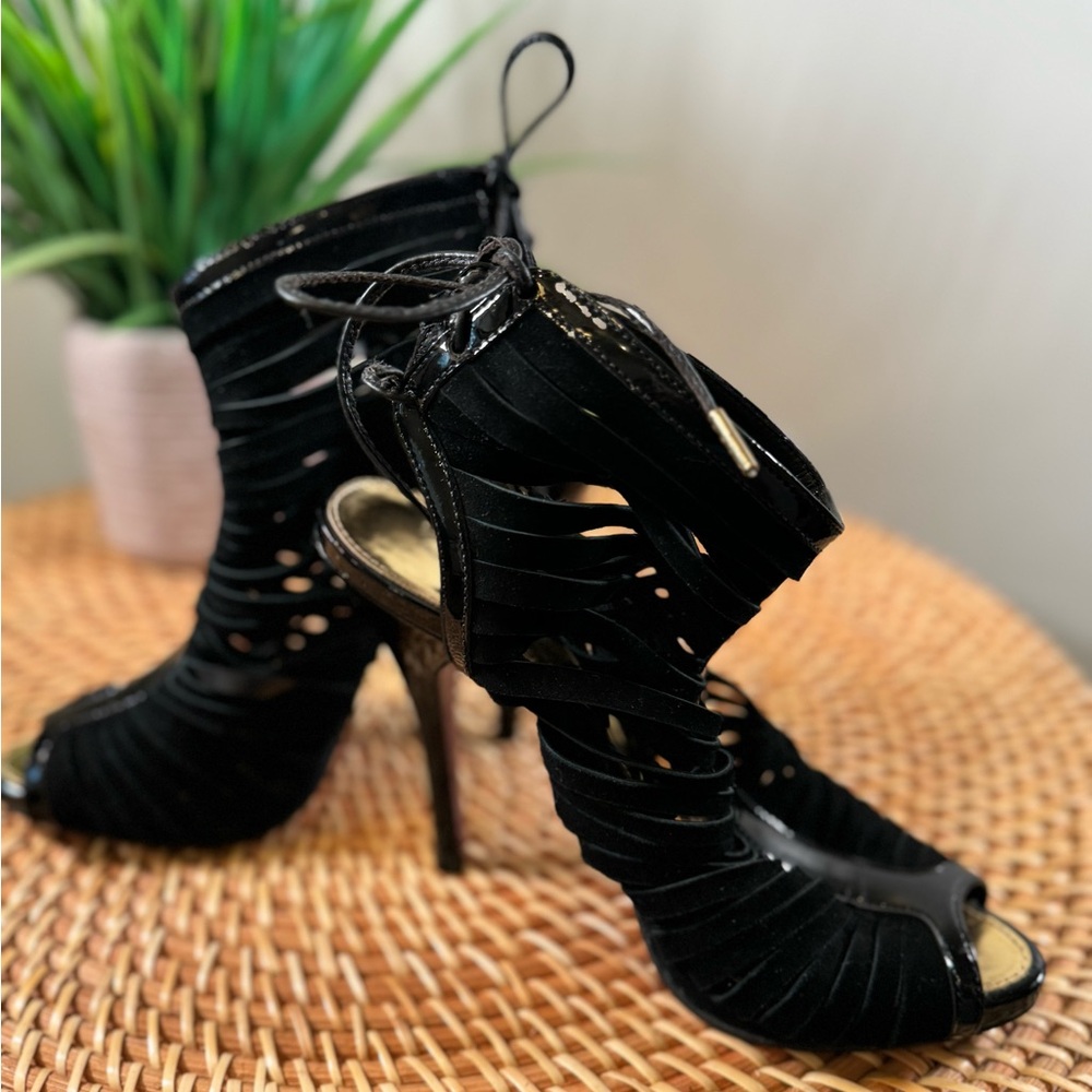 Size 7. Suede heel. Ties up the back. 3 1/2 inch heel